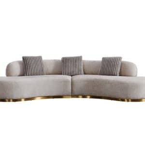 Curved beige 3-seater sofa with gold base and ribbed accent cushions